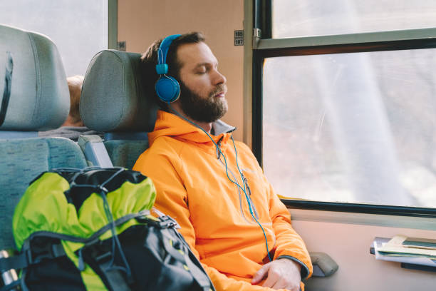 istock Relaxed man in the train 1340051839