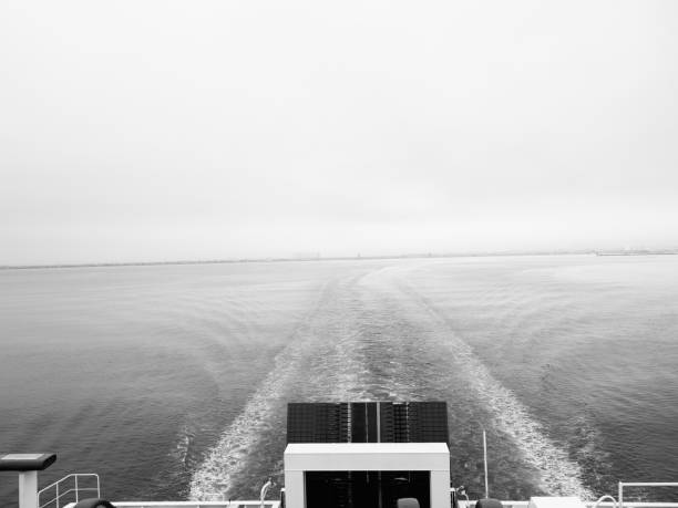 istock ship wake ripple trail on grey sea black and white banner 1340052462