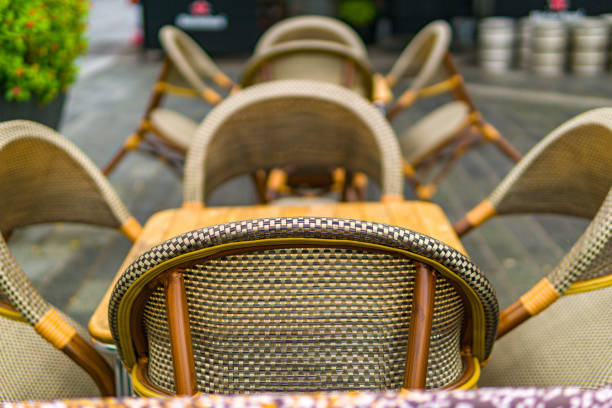 istock Chairs against tables in an outdoor space 1340052621