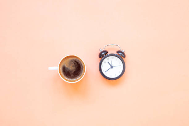 istock Top view, Turkish coffee and alarm clock on orange background 1340052808