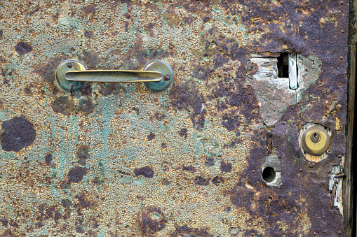 Rusty metal padlock on an old grunge metal gate