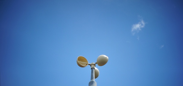 An anemometer is a device used for measuring wind speed, whereas a wind vane measures wind direction. Both are common weather station instruments