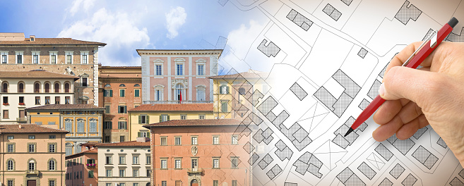 Register old buildings at buildings cadastre for taxation - Land registry concept with an imaginary cadastral map of territory and old italian historic buildings