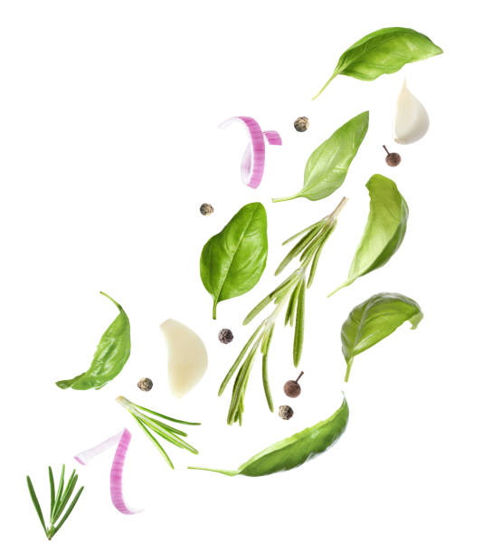 istock Basil leaves and other ingredients falling on white background 1340060320