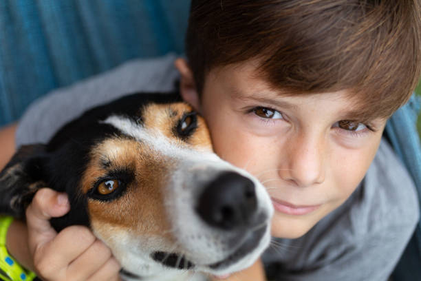 istock 10 years old boy with dog 1340063837