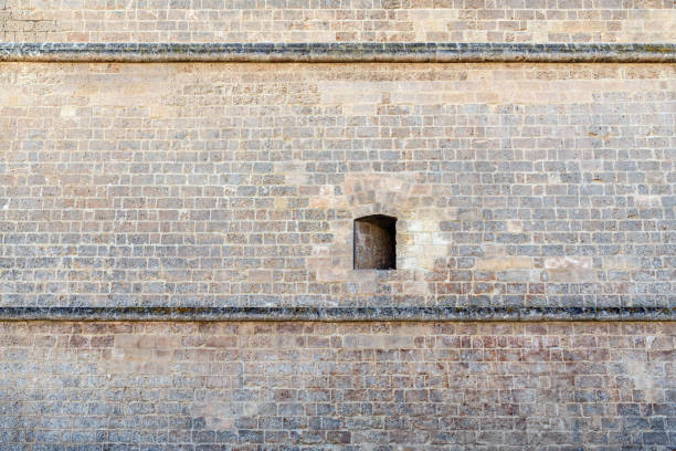 Old city red brick building with broken windows