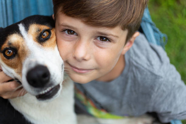 istock 10 years old boy with dog 1340063889