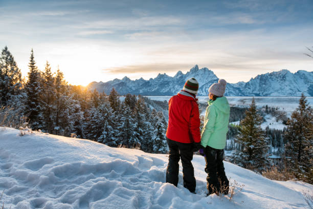 Mother and teenage daughter enjoying the winter views Mother and teenage daughter enjoying the winter views in Grand Teton National park snake river valley grand teton national park stock pictures, royalty-free photos & images
