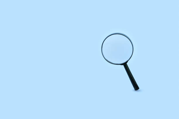 istock Magnifying glass on pastel blue background. Minimal creative search concept 1340066805