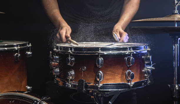 istock The drummer plays the snare drum with splashing water. 1340067761