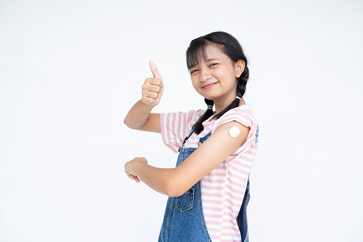 Young girl taking a vaccination. Virus protection. on white background.