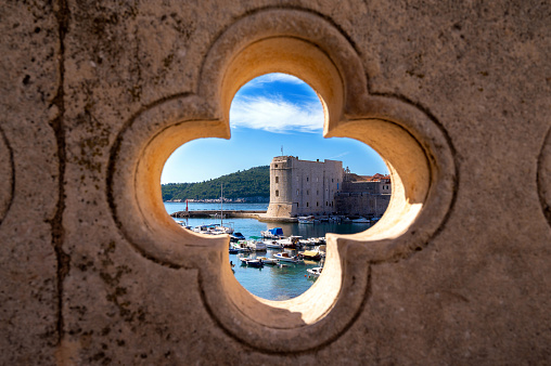 View of Dubrovnik harbor with boats and Old Town