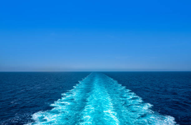 Boat wake ferry cruise wash foam blue sea stock photo