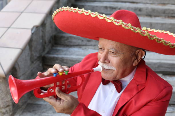 istock Senior mariachi playing the trumpet 1340072701
