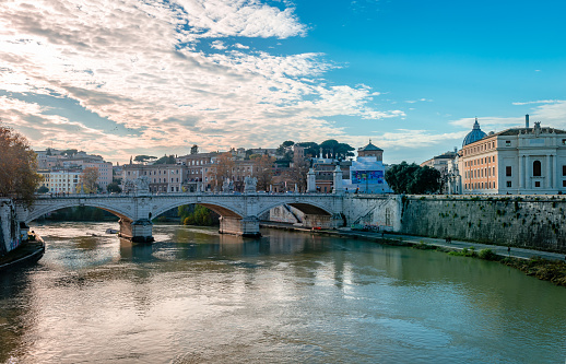 St. Peter's Basilica in Vatican and Tiber river in Rome at sunny day