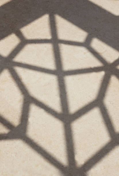 istock blurred shadow of shadow geometric shapes on the floor in full frame. 1340073088