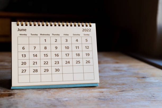 June 2022 Calendar Month page: June in 2022 paper calendar on the wooden table june photos stock pictures, royalty-free photos & images