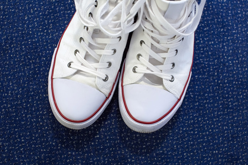 White sneakers with white laces photographed from above