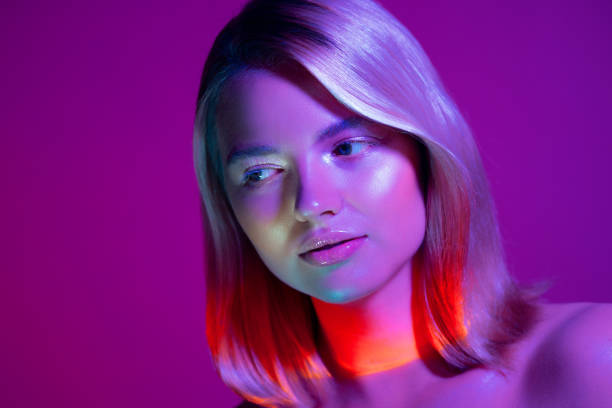 istock Portrait with neon-style lighting, a young beautiful blonde 1340080189