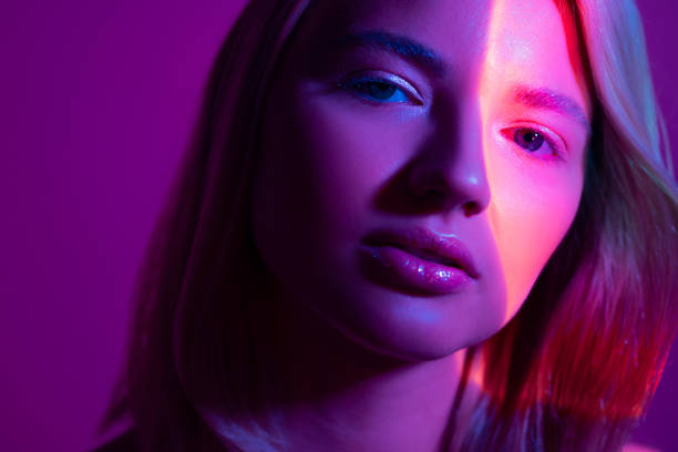 istock Portrait with neon-style lighting, a young beautiful blonde 1340080195