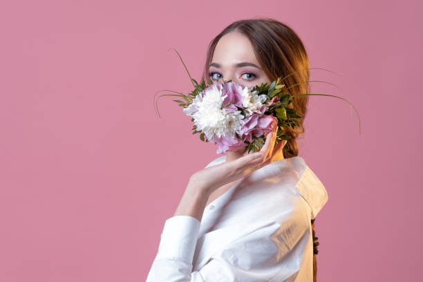 istock Protective face mask in flowers and petals, spring, 1340083693