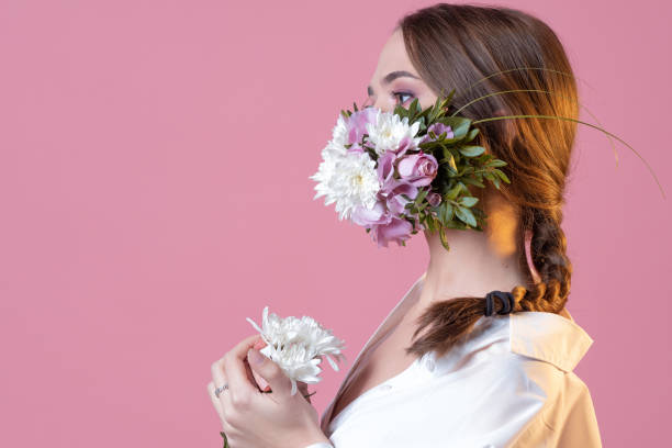 istock Protective face mask in flowers and petals, spring, 1340083695