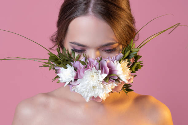 istock Protective face mask in flowers and petals, spring, 1340083846