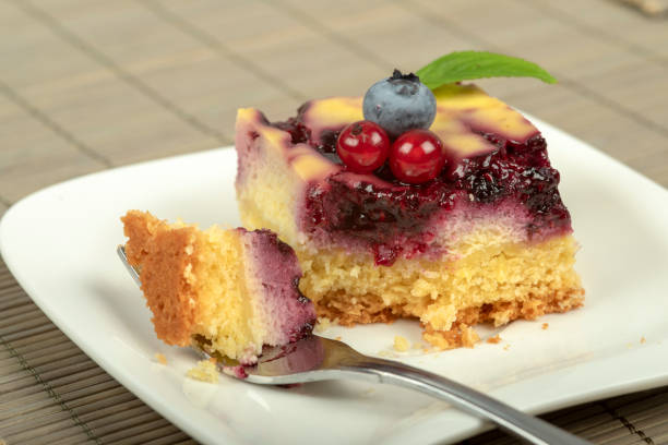 istock Home-made cake with cream cheese and small fruit. 1340083973