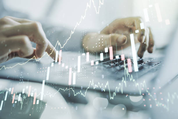istock Multi exposure of abstract creative financial chart with hand typing on computer keyboard on background, research and analytics concept 1340087595