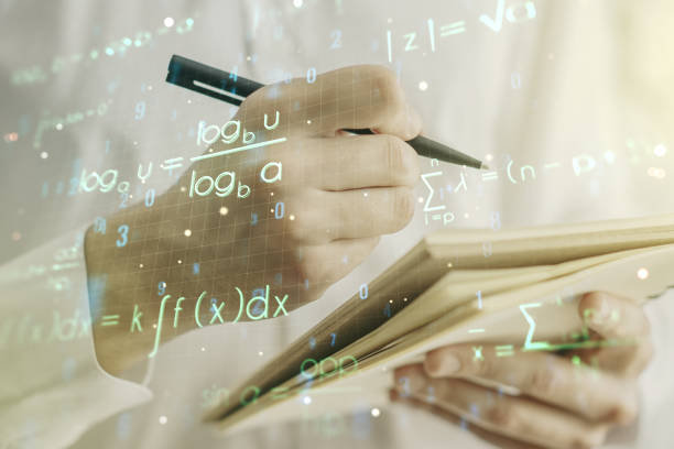 istock Creative scientific formula hologram with man hand writing in notepad on background, research concept. Multiexposure 1340087620