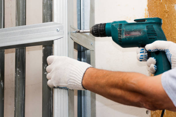 istock Screwing the crossbars with self-tapping screws. 1340087700