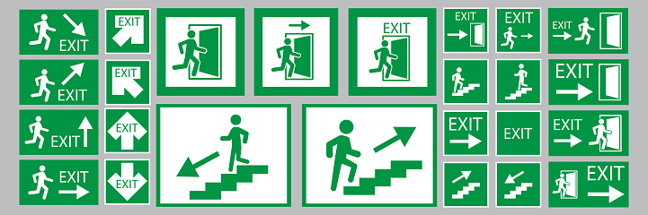 Exit signs. Evacuation symbol. Safety notice. White backdrop. Green background. Vector illustration. Stock image. EPS 10.