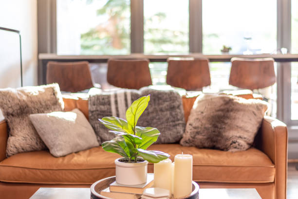istock Stylish casual home interior with cognac leather couch 1340093722