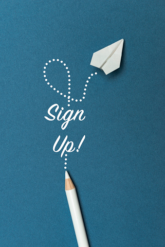 White pencil with Sign Up text and a white paper plane on blue background.
