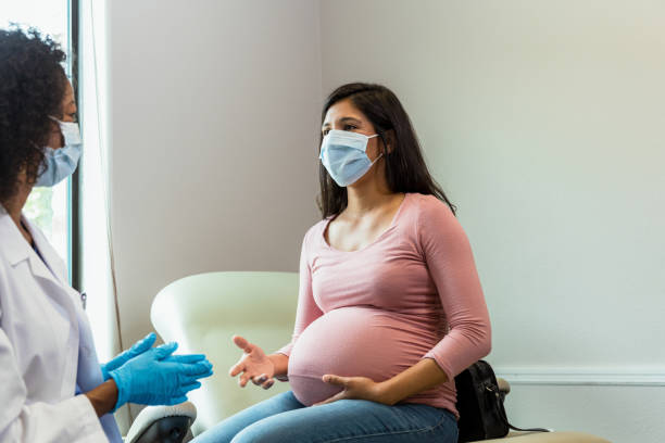 istock Expectant mother visits doctor during epidemic 1340094812