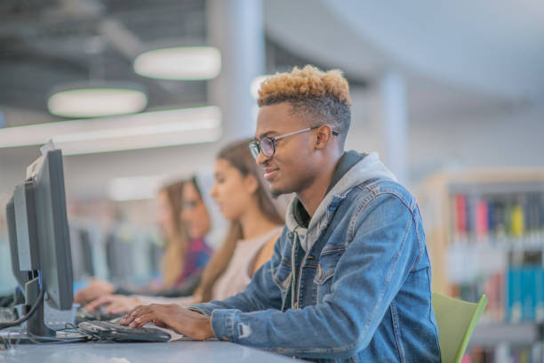 istock A group of University students working away in a computer lab 1340096506
