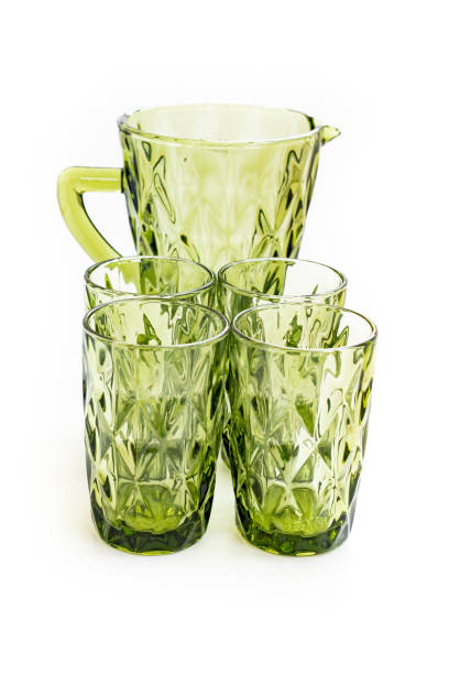 istock green glass carafe and glasses for drinks. set of tableware 1340096827