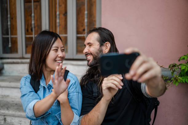 istock Multi-ethnic Couple Taking selfie while discovering the city 1340097054