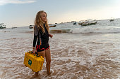 istock A woman carrying the first aid medical kit on a shore. 1340098306
