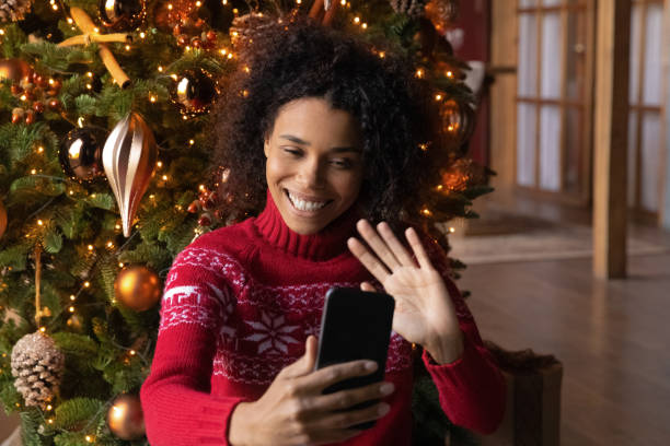 istock Smiling ethnic woman have webcam call on Christmas 1340098630