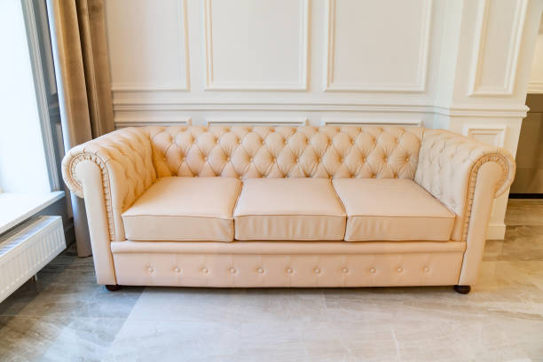 istock white leather sofa for home and office. upholstered furniture store. 1340101043