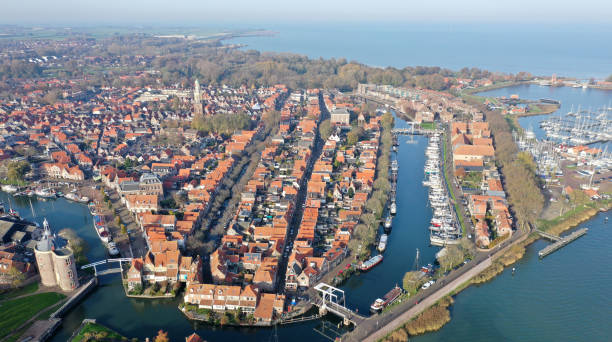 drone photo of enkhuizen , holland aerial drone photo of the beautiful historic city of enkhuizen, with old town marina harbors in the netherlands enkhuizen stock pictures, royalty-free photos & images