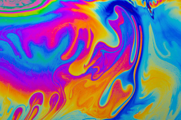 istock Rainbow colors. Psychedelic multi colored patterns background. Photo macro shot of soap bubbles 1340101329