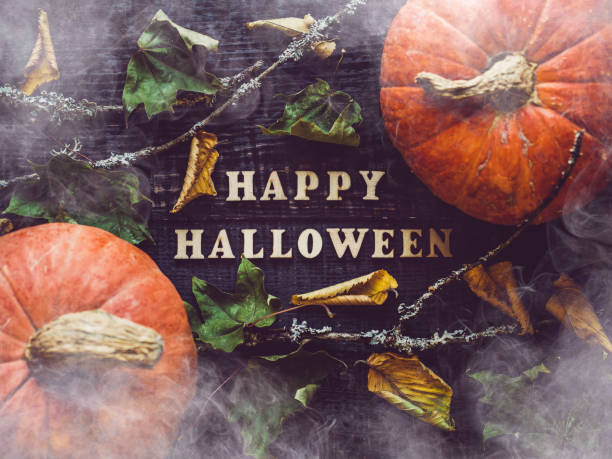 istock Happy Halloween. Pumpkins lying on the table 1340101338