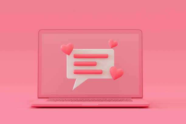 istock Speech Bubble with Hearts on Laptop, Pink Background 1340101705