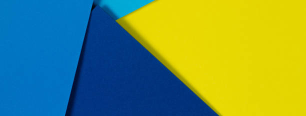 istock Abstract color papers geometry flat lay composition background with blue and yellow tones 1340104217