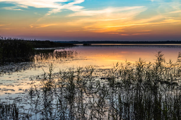 istock Romantic Sunset Glowing Twilight Over the Lake 1340105593
