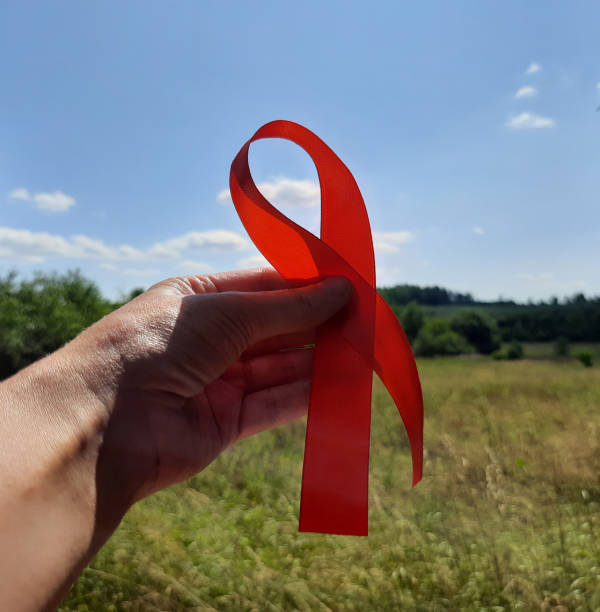 istock red ribbon in the hands 1340105835