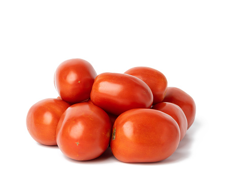 ripe red tomatoes on a white background. Autumn harvest