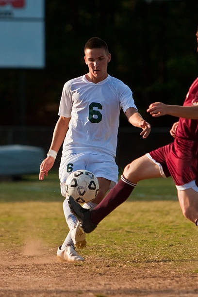 istock Male Soccer Player Kicks Ball 134011091